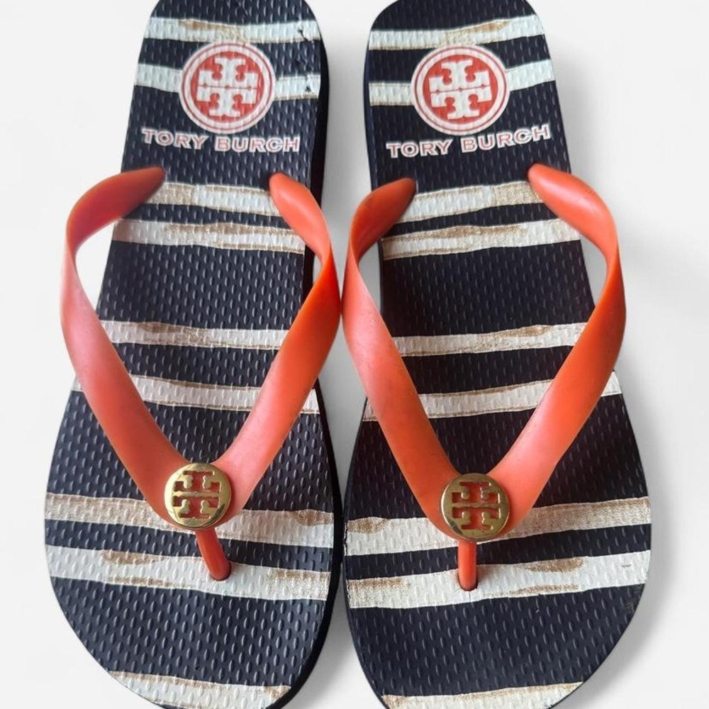 Tory Burch orange, navy, and cream striped flip flops